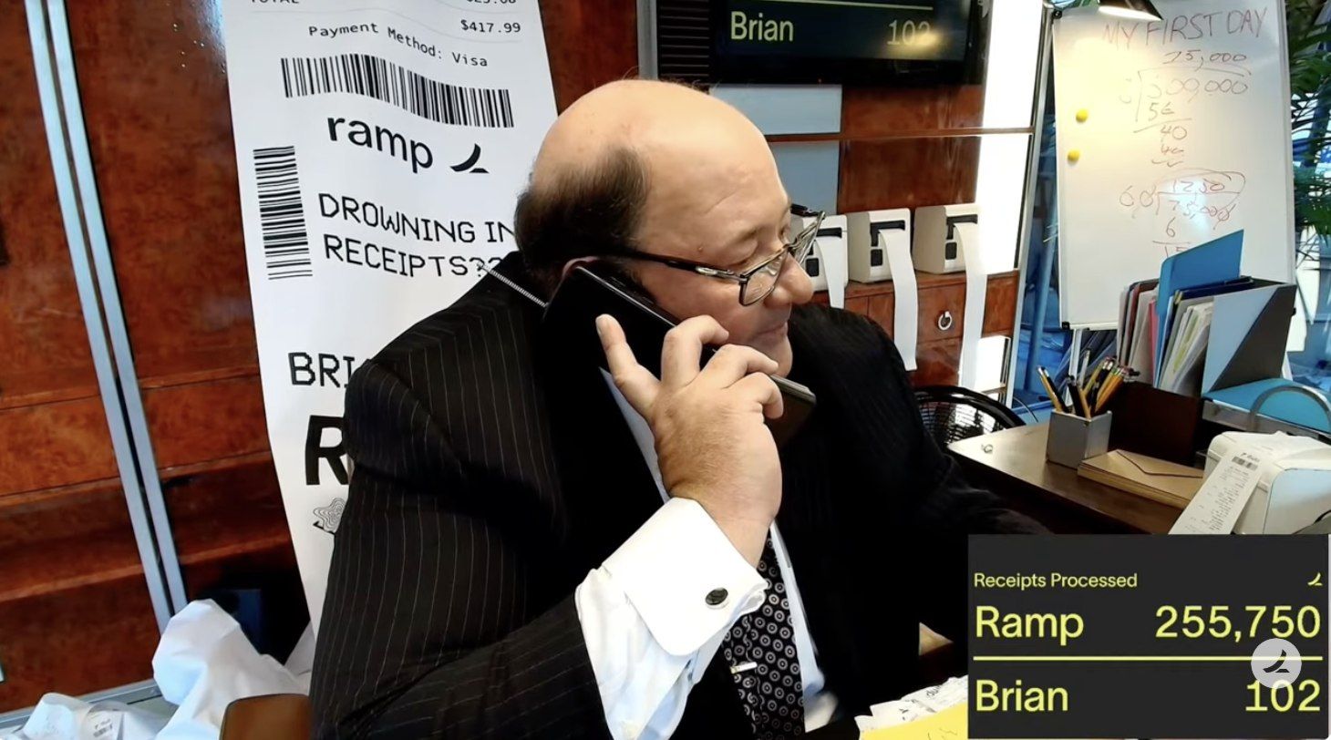 Brian on the phone beside the livestream scoreboard: Ramp 255,750, Brian 102