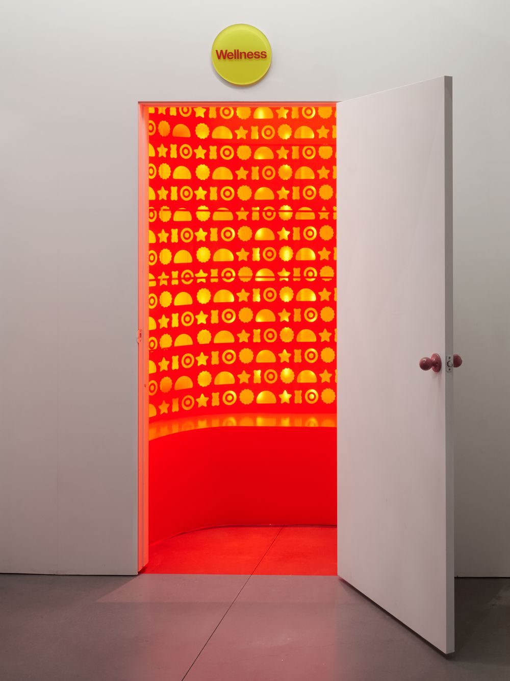 An open door revealing a glowing red room